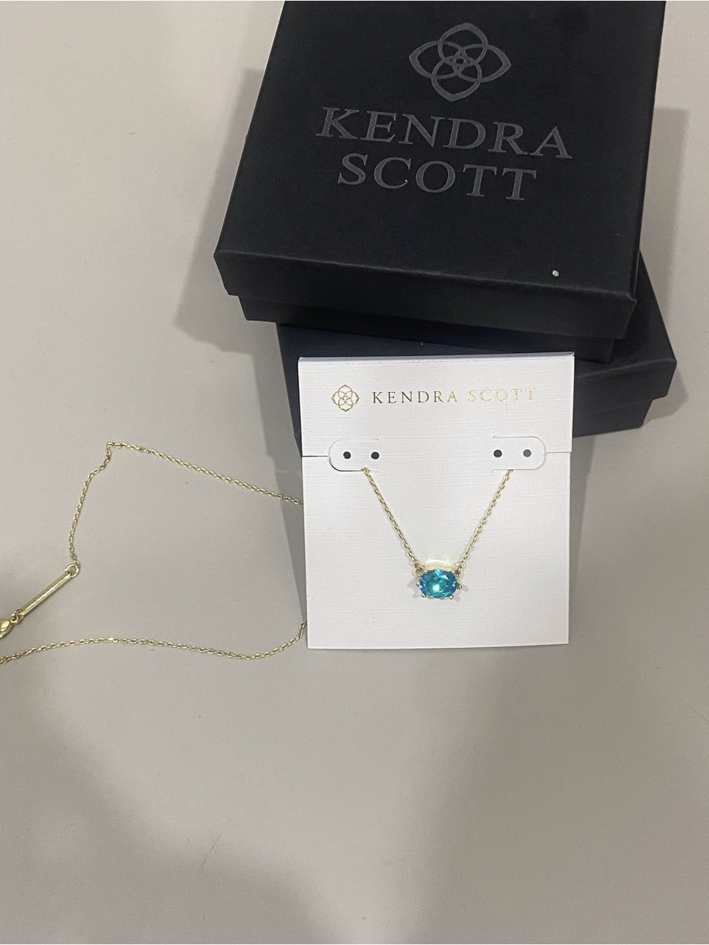 Kendra Scott Gold Necklace with Teal Oval Stone